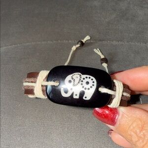 5 for $25. Bundle to save. Elephant Design Black and Brown Bracelet. Unisex